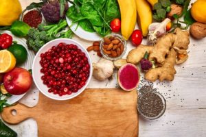 a cutting board with fruits and vegetables that are high in antioxidants on it