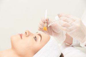 Relaxed female patient undergoing chemical peel in Chicago