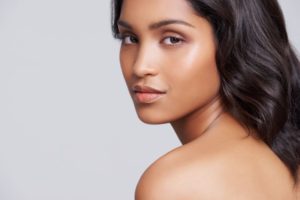 Woman with beautiful skin looking over her shoulder